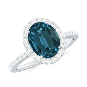 1.75 CT Classic Oval Cut London Blue Topaz Ring with Diamond Halo