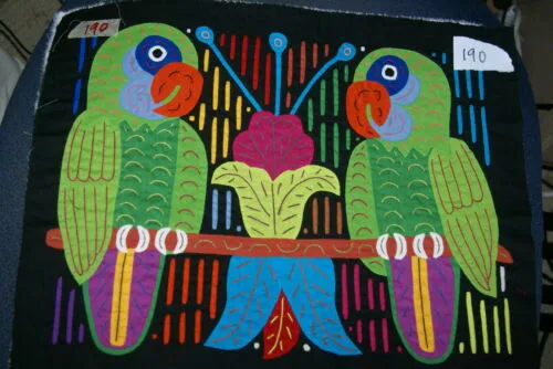 A Framed Kuna Indian Folk Art Mola from San Blas Islands, Panama in Hand Painted Frame With Wood Leaves, Glass & Double Mats. Hand stitched  Applique: Green Parrots On a Perch 20.5" X 17.5" (DFM20) WALL DECOR