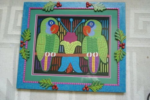 A Framed Kuna Indian Folk Art Mola from San Blas Islands, Panama in Hand Painted Frame With Wood Leaves, Glass & Double Mats. Hand stitched  Applique: Green Parrots On a Perch 20.5" X 17.5" (DFM20) WALL DECOR