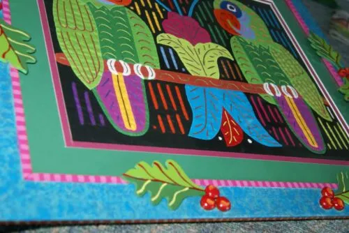 A Framed Kuna Indian Folk Art Mola from San Blas Islands, Panama in Hand Painted Frame With Wood Leaves, Glass & Double Mats. Hand stitched  Applique: Green Parrots On a Perch 20.5" X 17.5" (DFM20) WALL DECOR
