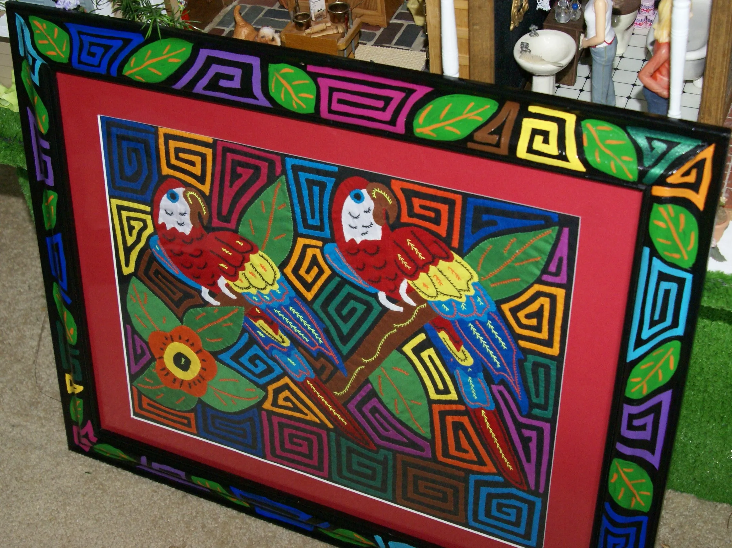 A Kuna Indian Folk Art Mola from San Blas Islands, in Custom Unique Hand Painted Signed Frame with red Mat: Hand stitched Textile Applique: Colorful Macaw Parrots & Hibiscus Flowers, 21.5" x 17" (DFM18) Wall Décor