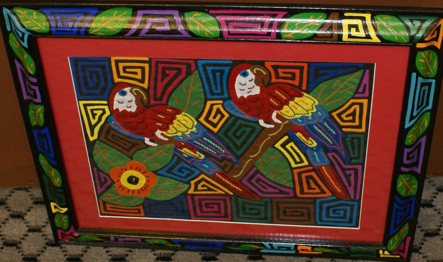 A Kuna Indian Folk Art Mola from San Blas Islands, in Custom Unique Hand Painted Signed Frame with red Mat: Hand stitched Textile Applique: Colorful Macaw Parrots & Hibiscus Flowers, 21.5" x 17" (DFM18) Wall Décor