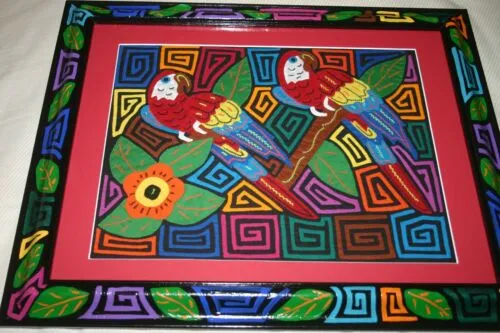 A Kuna Indian Folk Art Mola from San Blas Islands, Panama. Wall Decor, in Custom Frame & Mat. Hand stitched Textile Applique: Colorful Parrot & Hibiscus Flowers, plants 16" x 12" (DFM3)