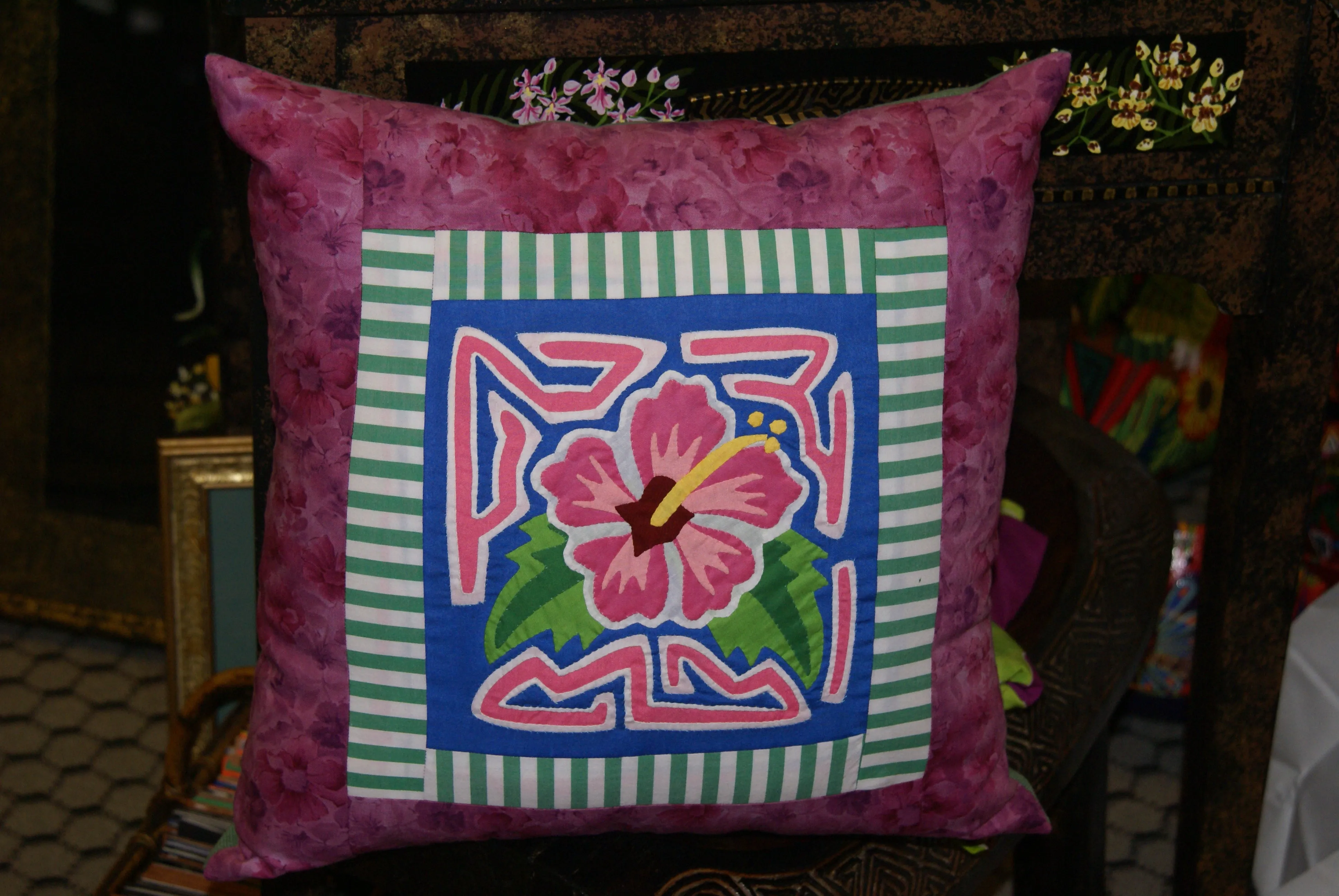 A Kuna Indian Folk Art Mola from San Blas Islands, Panama. Wall Decor, in Custom Frame & Mat. Hand stitched Textile Applique: Colorful Parrot & Hibiscus Flowers, plants 16" x 12" (DFM3)
