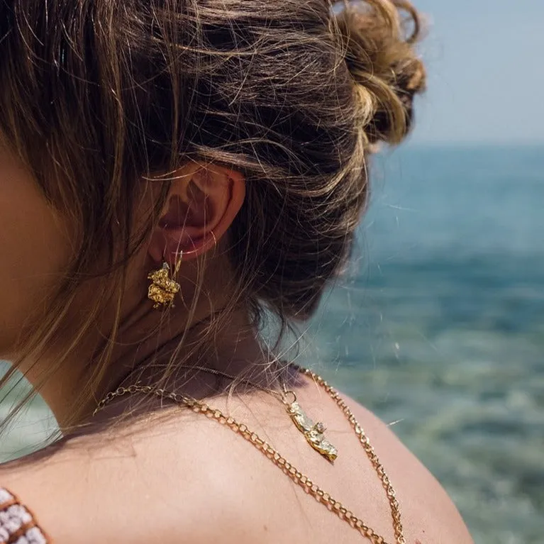 Curved molten coral rock earring