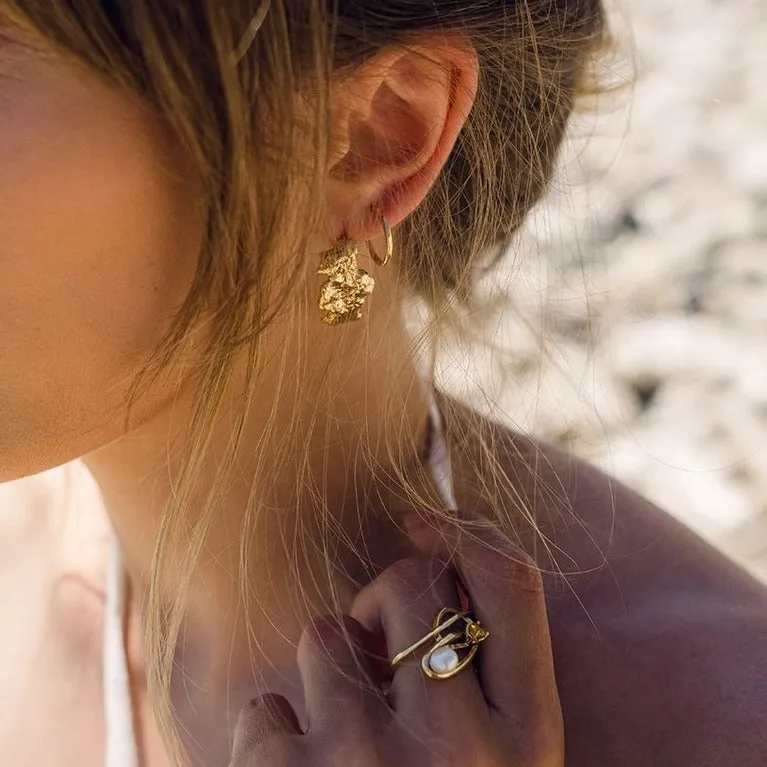 Curved molten coral rock earring